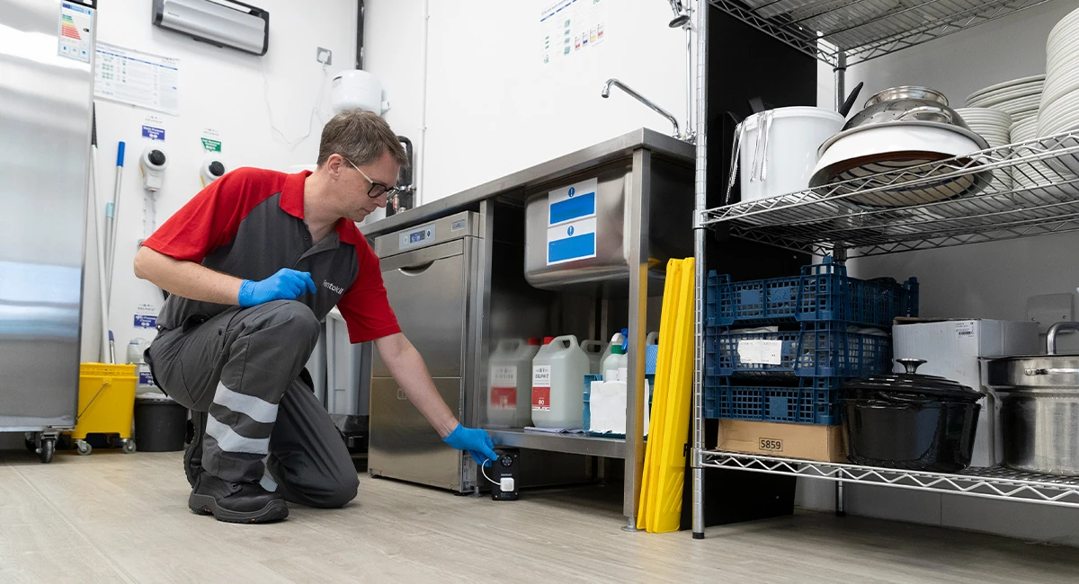 Rentokil technician servicing pestconnect optix