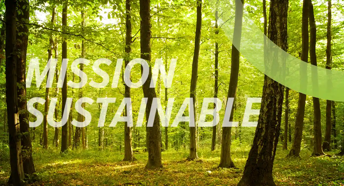a view of a forest with the words "mission sustainable" laid over it