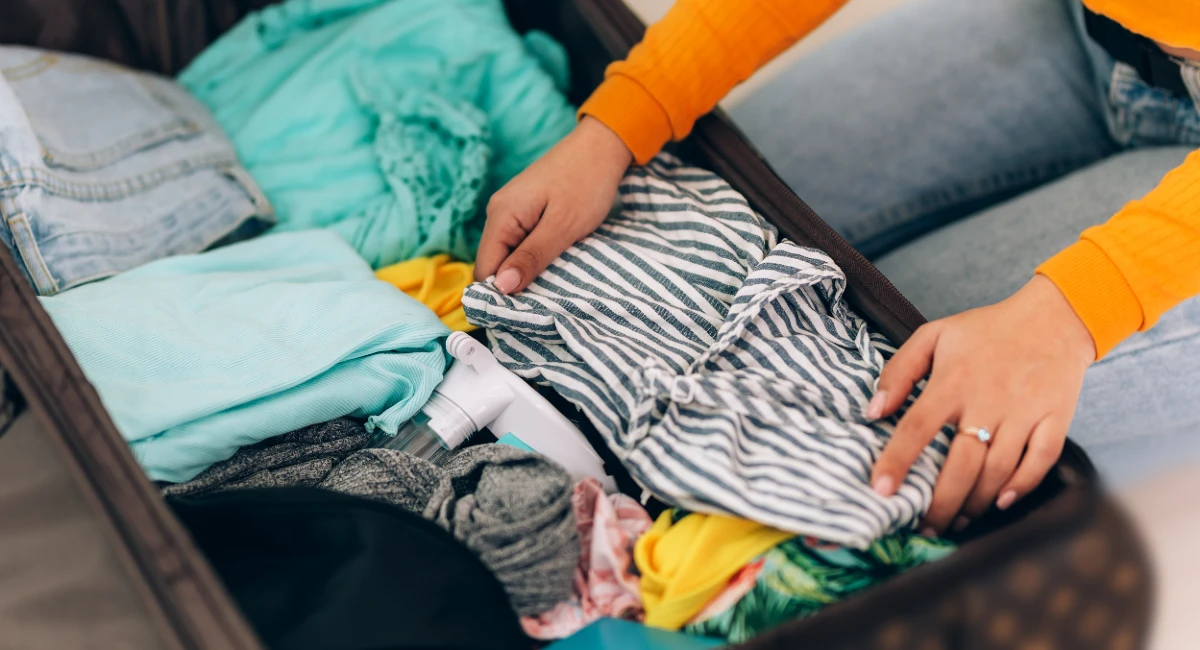Woman Un-packing Clothes