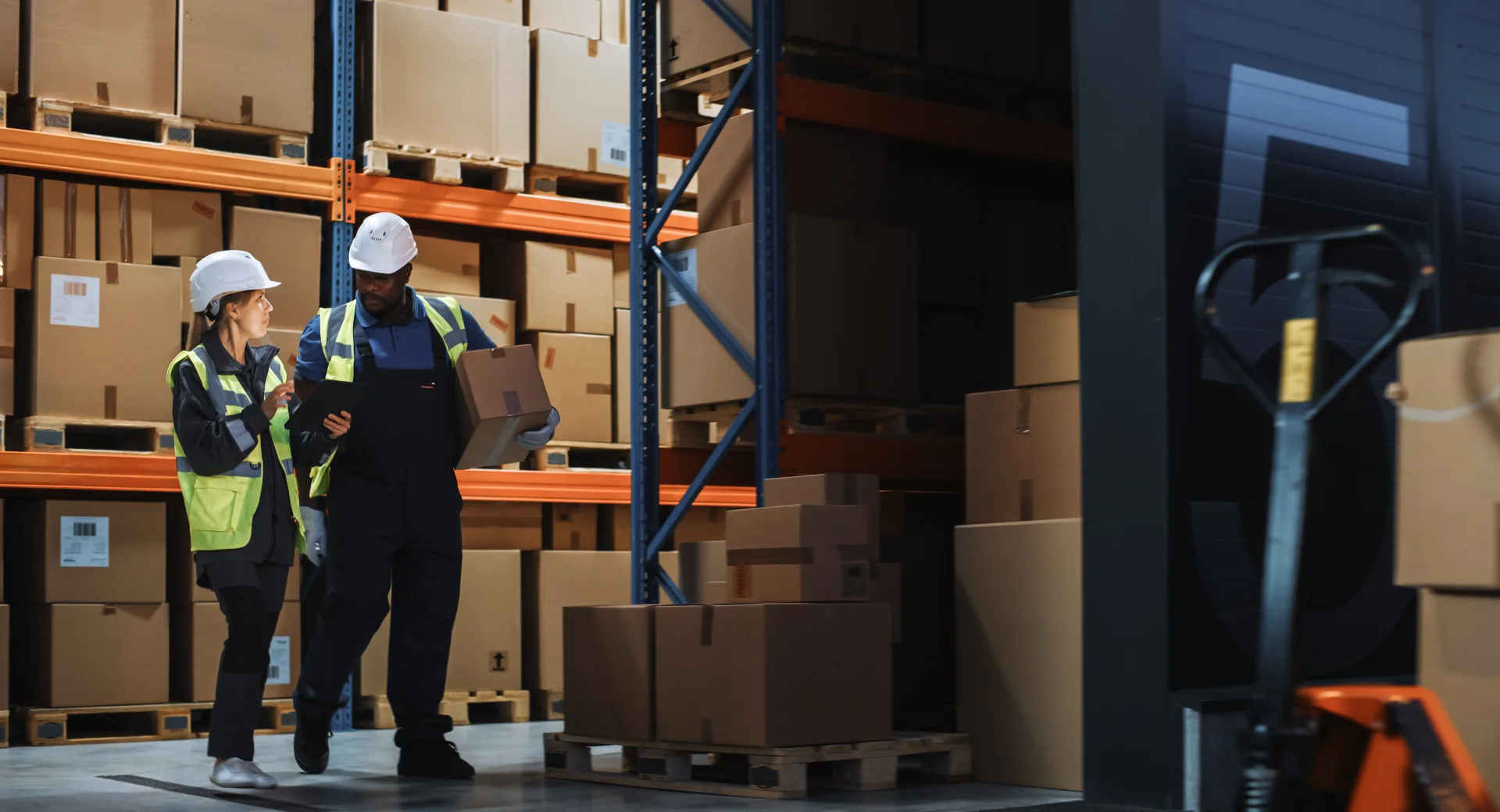 Warehouse manager overseeing the preparation of a delivery