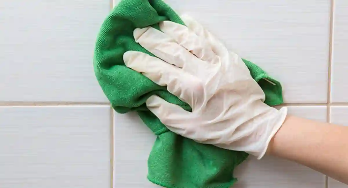wiping tile clean