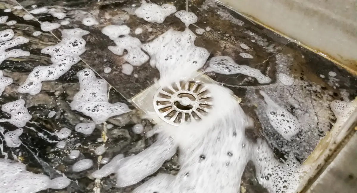 Floor drain with soap and water going down it